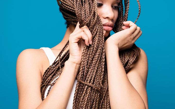 “Mastering the Art of Two Feed-In Braids: A Stylish Twist to Your Hair Game”
